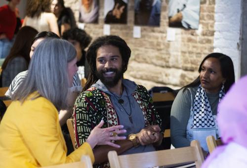 People at an event sat down and having a conversation